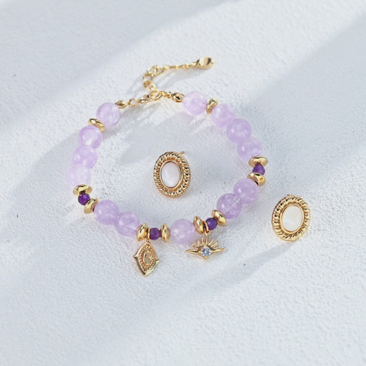 Armband mit violettem Naturkristall, Zirkonia & Symbol-Charme